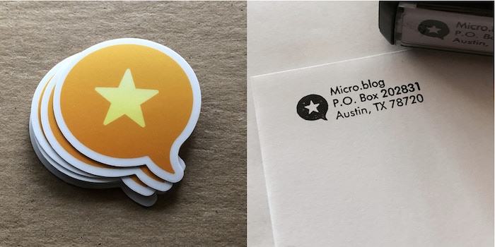A stack of stickers with the Micro.blog logo and an envelope with an address of Micro.blog, P.O. Box 202831, Austin, TX 78720